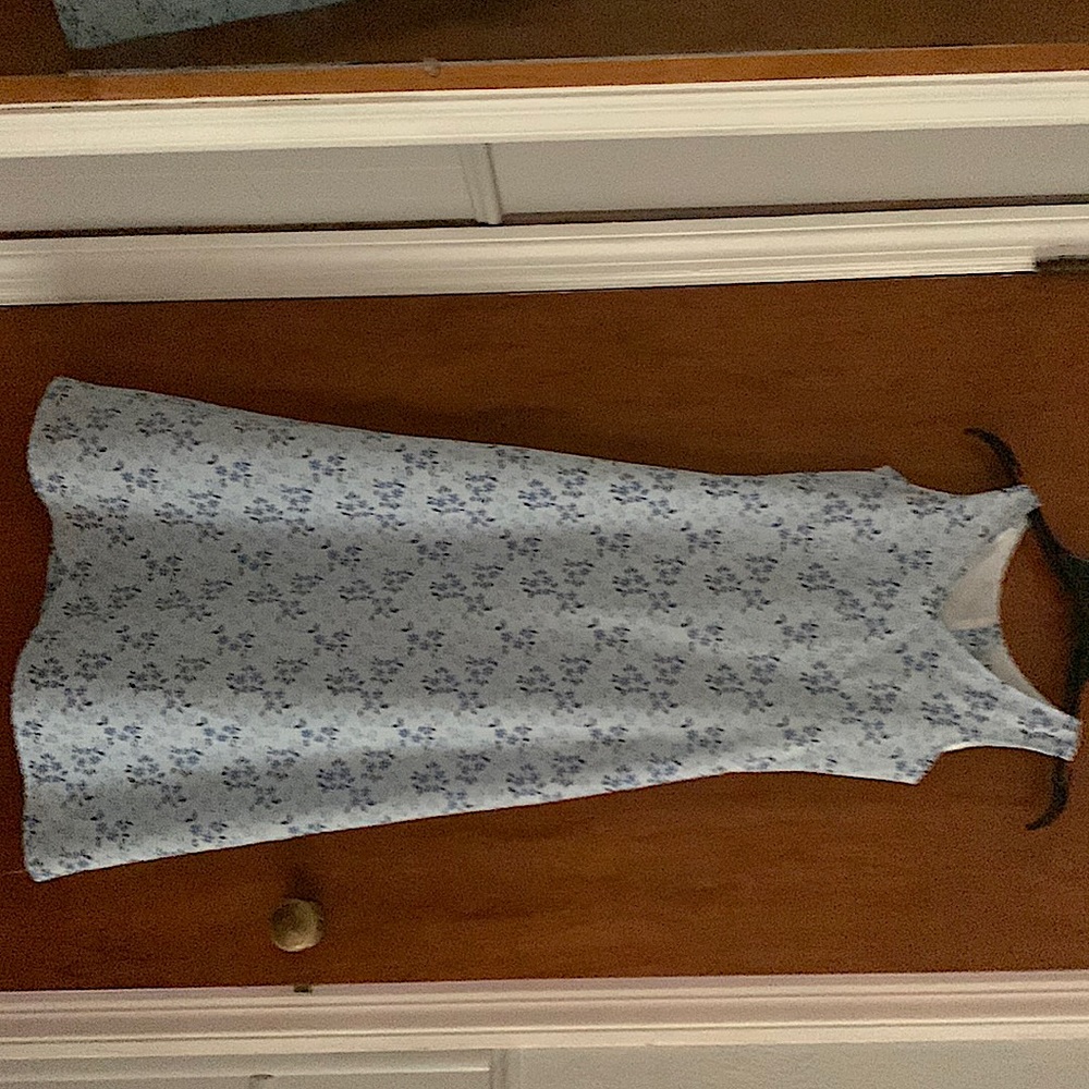 A light blue dress with blue and white flowers